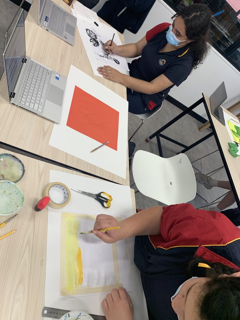 Year 9 Visual Arts students working on large Post-It Note entries